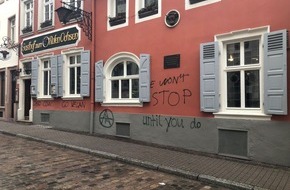 Polizeipräsidium Mannheim: POL-MA: Heidelberg-Altstadt: Hauswand von Gaststätte erneut mit Parolen besprüht - Polizei sucht Zeugen