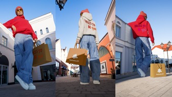 McArthurGlen Designer Outlets: Dress To Be You: McArthurGlen feiert Mode, Individualität und Selbstentfaltung / Neuer Kampagnen-Launch mit Dawid Tomaszewski und exklusivem Hoodie als Fashion-Statement