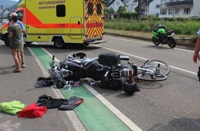 Polizeidirektion Koblenz: POL-PDKO: Motorradfahrer reißt Radfahrerin mit