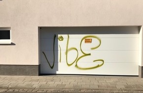 Polizeipräsidium Westpfalz: POL-PPWP: Hauswand und Garagentor mit Farbe besprüht