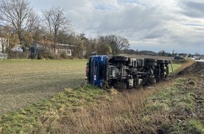 Polizeidirektion Landau: POL-PDLD: Lkw kommt von der Fahrbahn ab und kippt um - Fahrer bleibt unverletzt