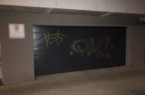 Polizeipräsidium Westpfalz: POL-PPWP: Garage und Hauswand mit Farbe besprüht