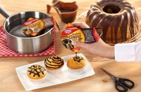 Dr. Oetker - Dr. August Oetker Nahrungsmittel KG: Alles im Griff?! / Dr. Oetker Kuchenglasuren im Becher - mit Griff und integrierten T&uuml;llen f&uuml;r komfortables Glasieren & Verzieren (BILD)