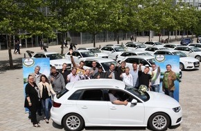 Krombacher Brauerei GmbH & Co.: "Öffnen. Gewinnen. Abfahren." / Krombacher übergibt 18 glücklichen Gewinnern in Ingolstadt ihren neuen Audi A3 Sportback