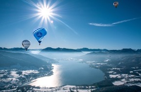 Tegernseer Tal Tourismus GmbH: 25 Jahre Montgolfiade - ein Vierteljahrhundert Farbtupfer am Winterhimmel