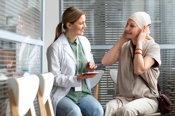 middle-aged-woman-with-skin-cancer-talking-with-her-doctor.jpeg